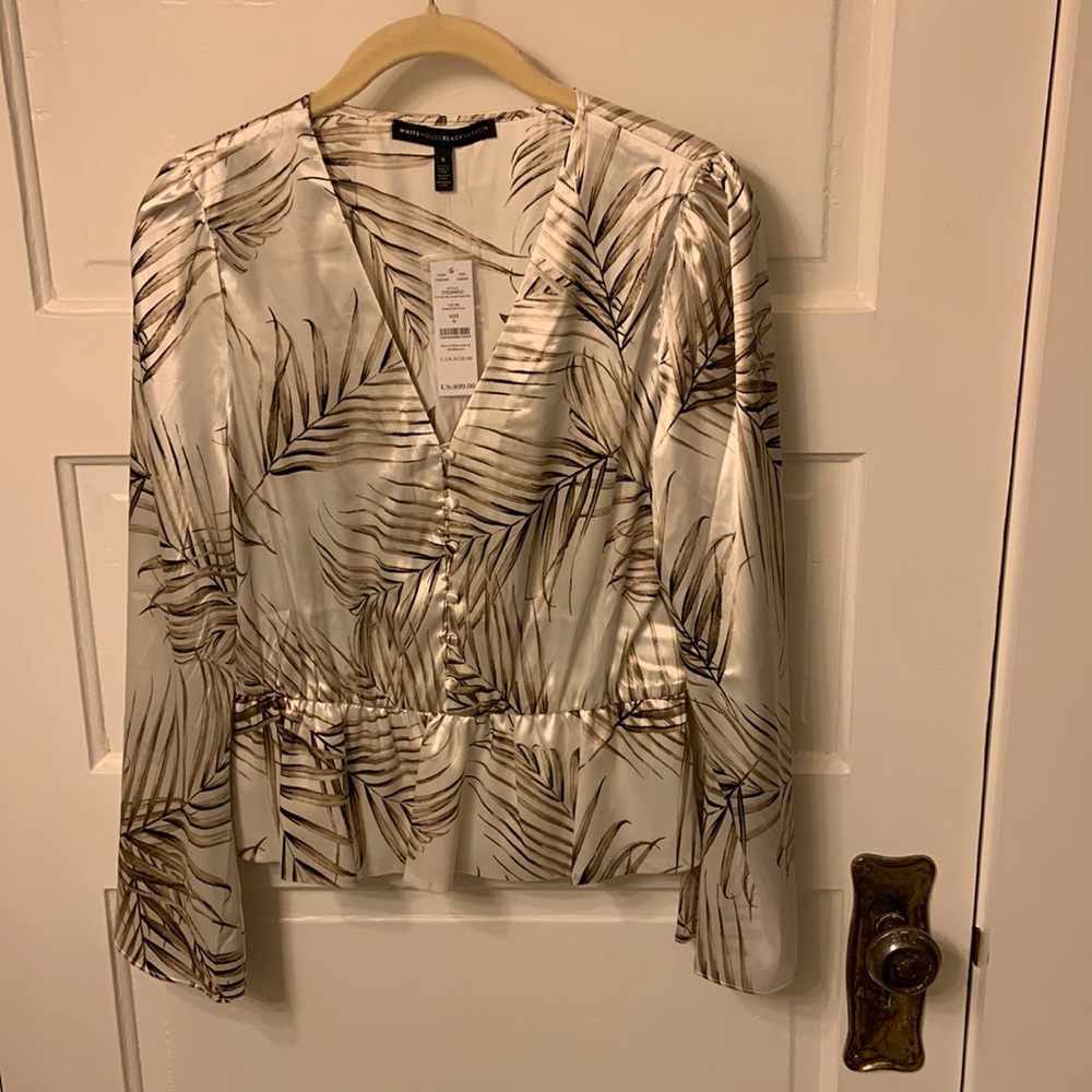 WHBM v-neck top with ruffle hem. Size small, palm print